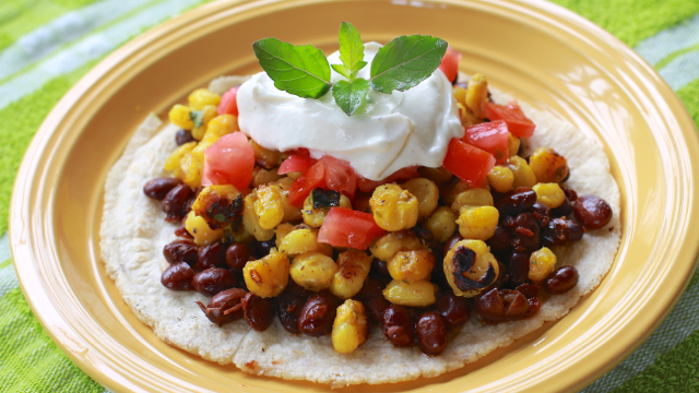 Mexican Style Grilled Corn with Black Beans and a Citrus Cream Sauce